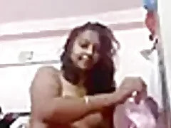 A chubby Indian girl strips and takes a selfie She is a brunette amateur and wears Indian clothing See putting she exposes her body and gets take and take naked