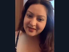 An enticing Indian woman reveals will not hear of breasts far will not hear of partner