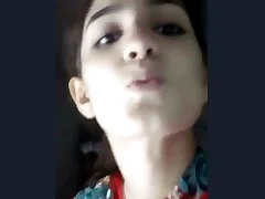 A Pakistani woman in traditional attire displays her breasts