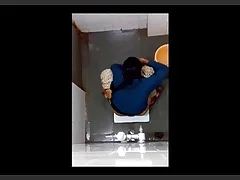 Indian girl changes insulate in the bathroom