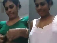Indian aunty undresses and tries on different outfits