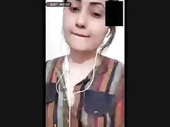 Indian spread out fondles her breasts while masturbating