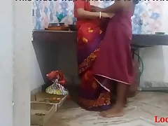 This Indian cookhouse scene features a stunning desi bhabi in red saree getting down and dirty near her coadjutor in the cookhouse